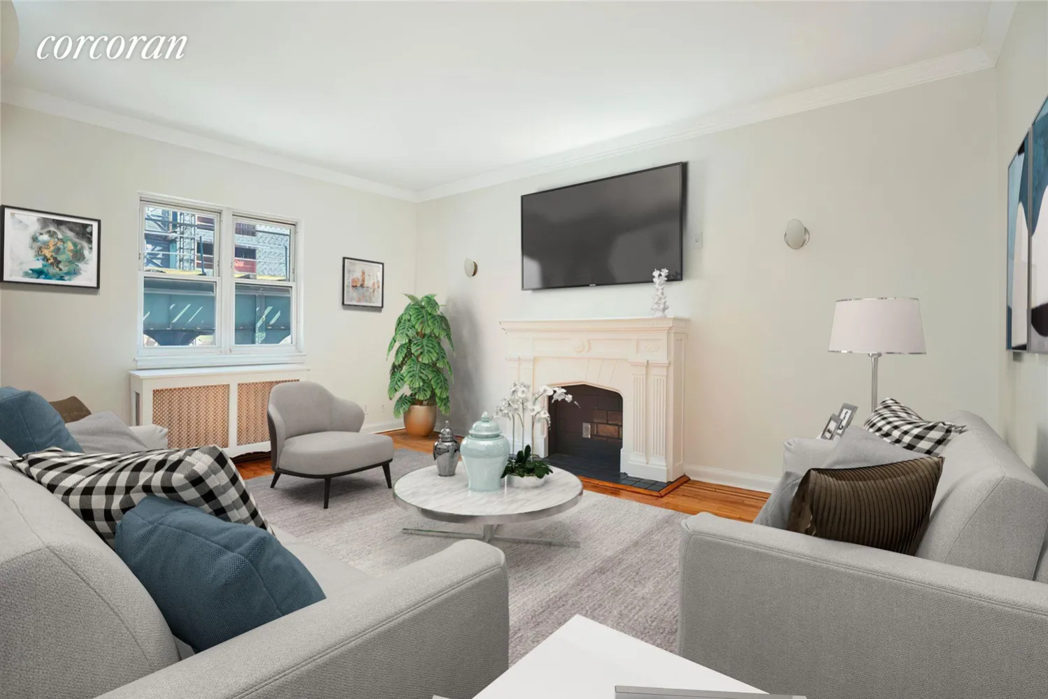 a living room with furniture a flat screen tv and a fireplace