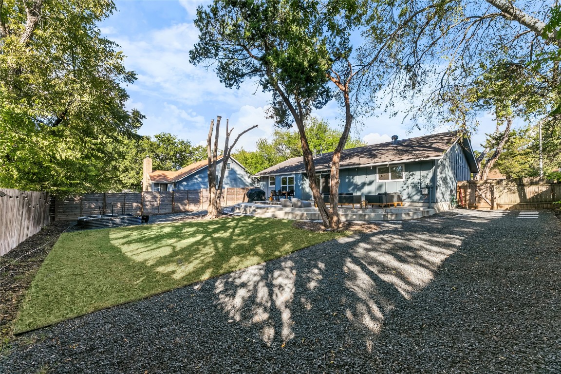 a view of outdoor space with garden and trees