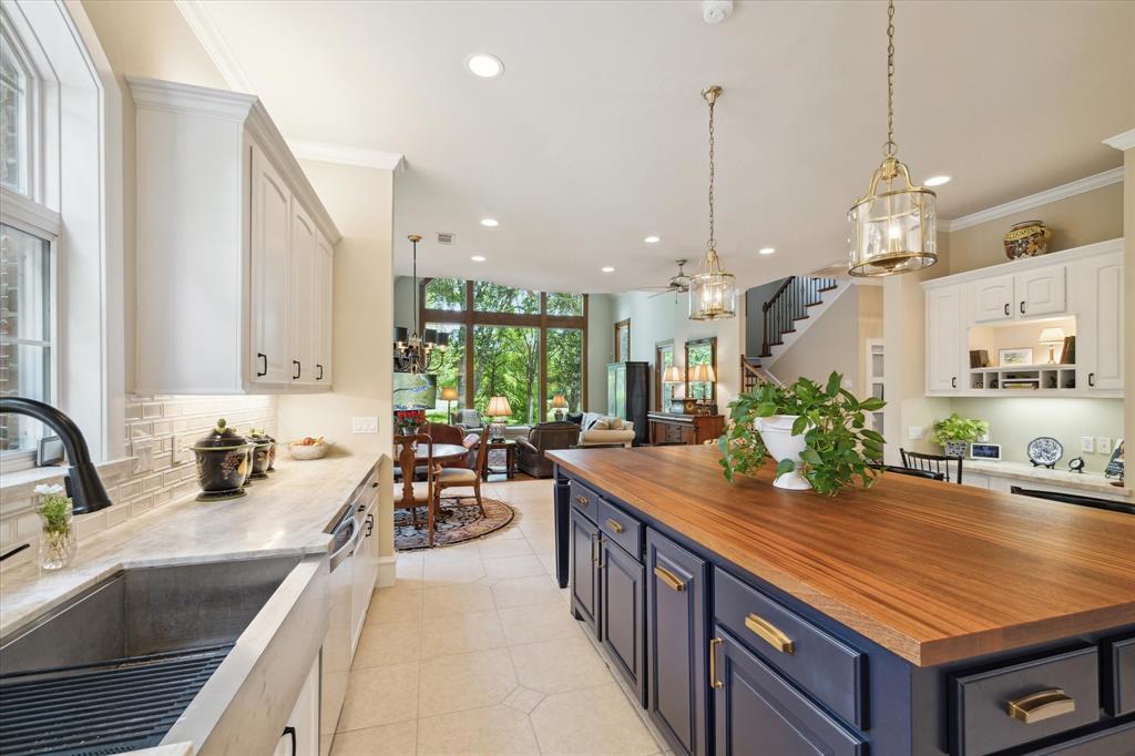 a kitchen with lots of counter space and windows