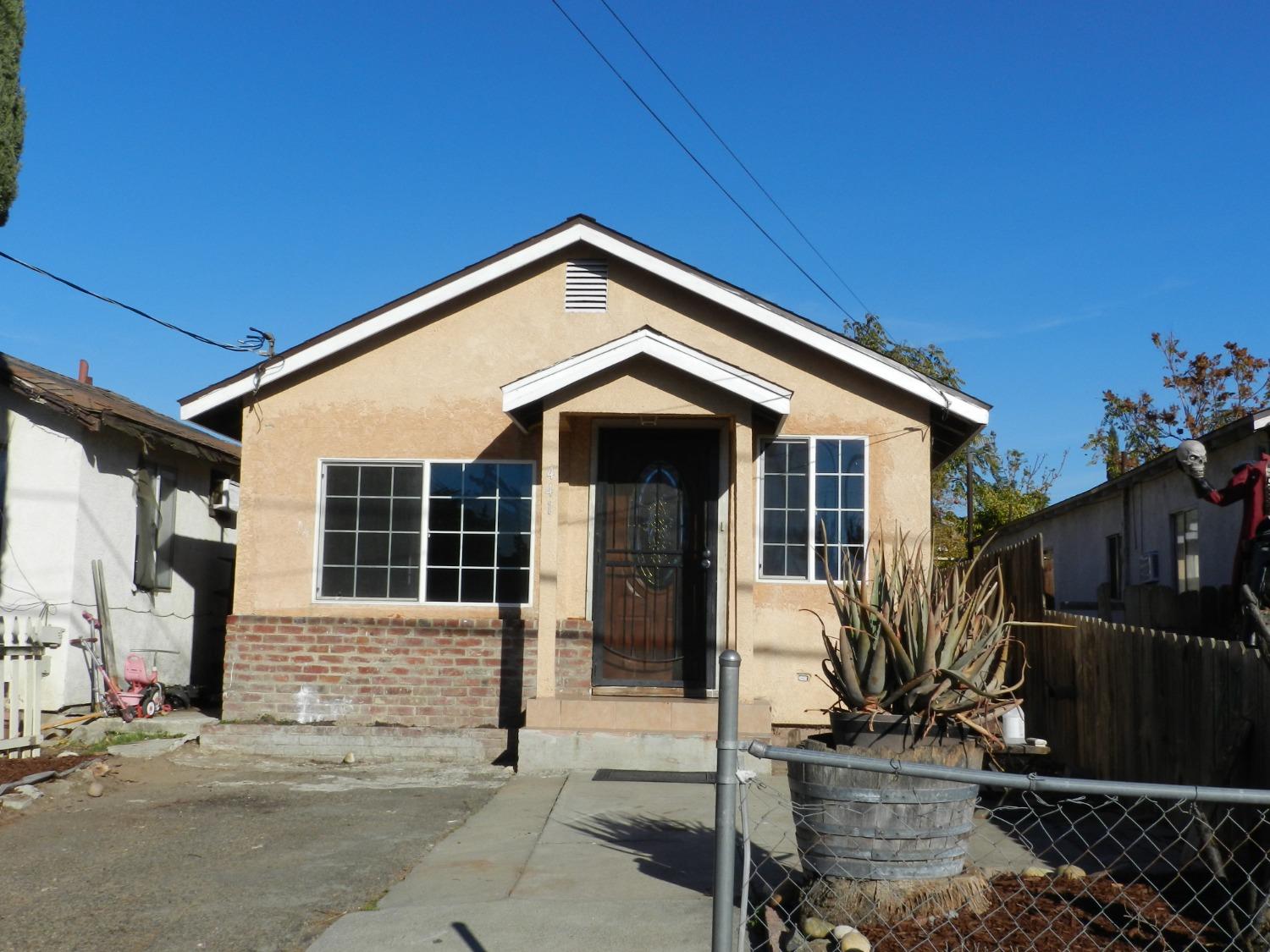 a front view of a house with parking space