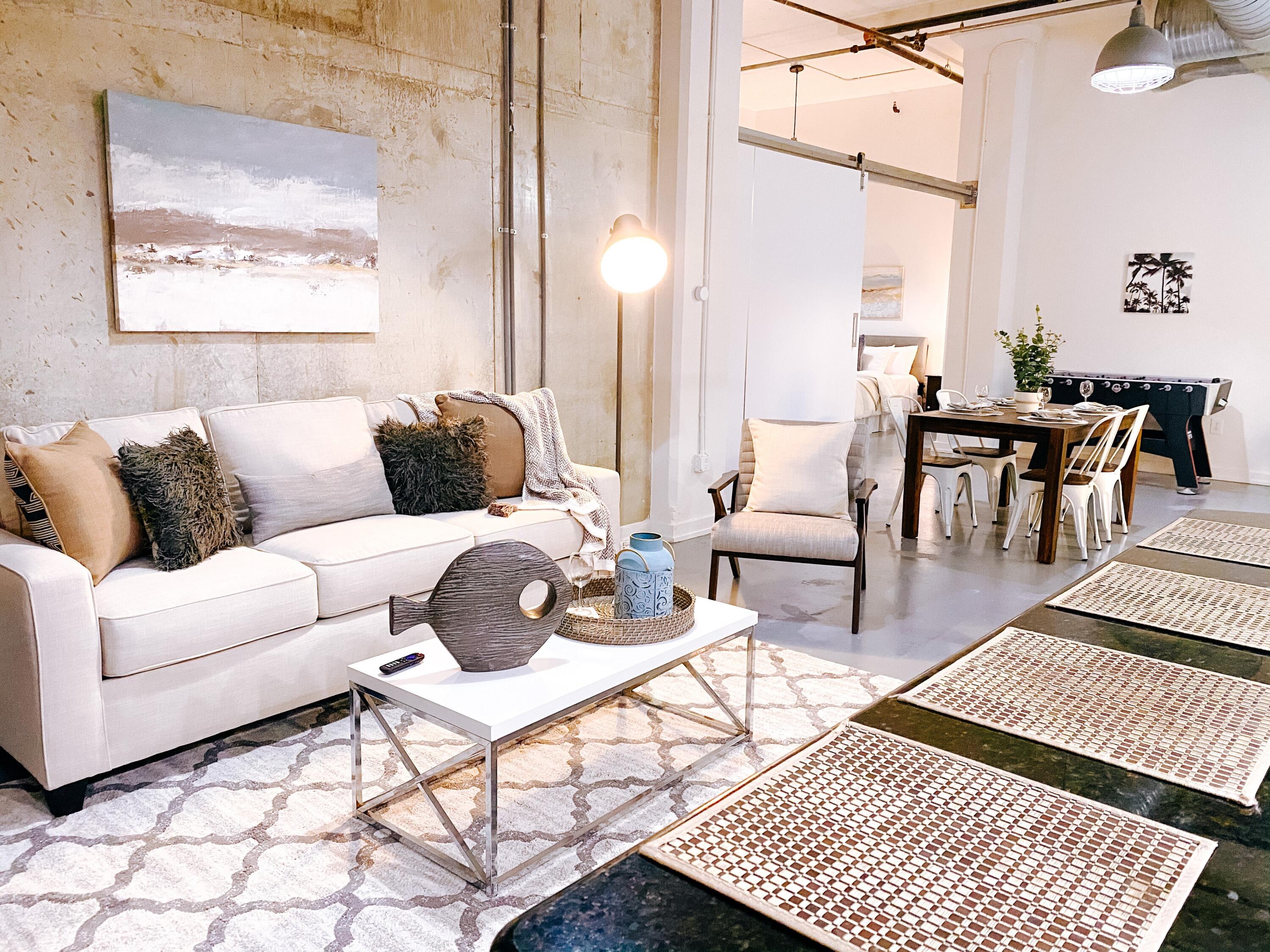 a living room with furniture and a rug