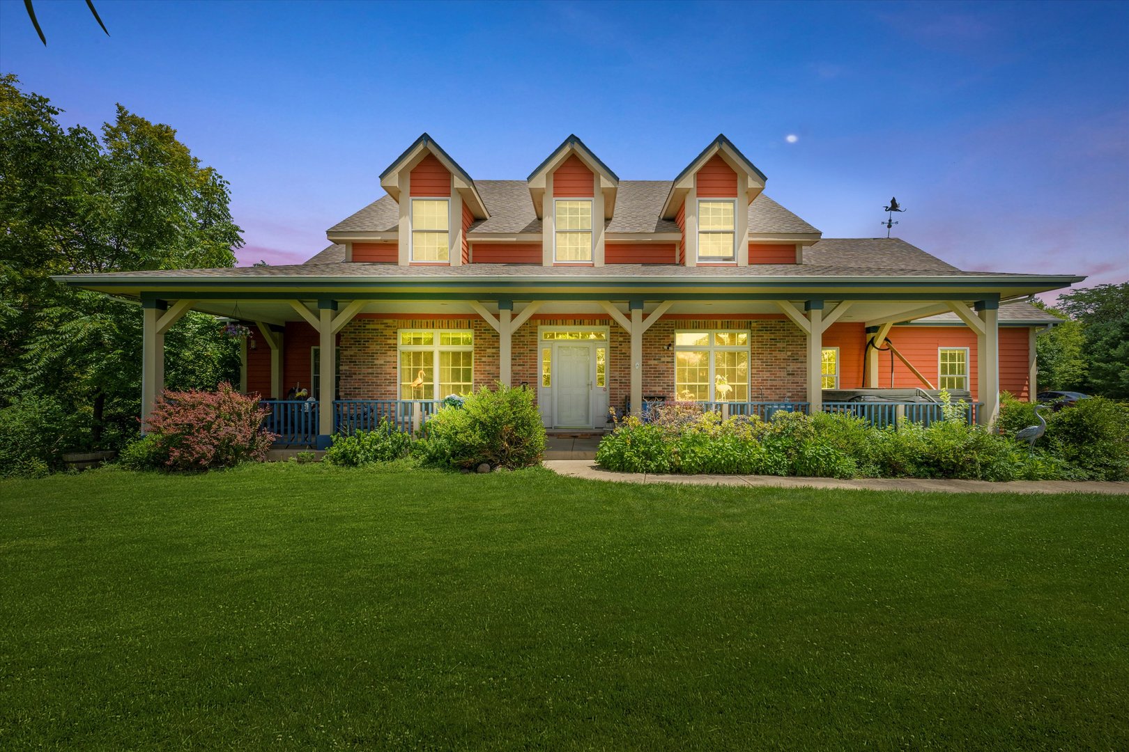 a front view of a house with garden