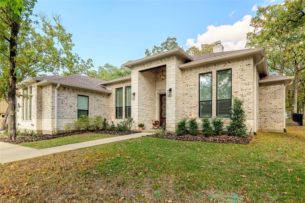 front view of a house with a yard