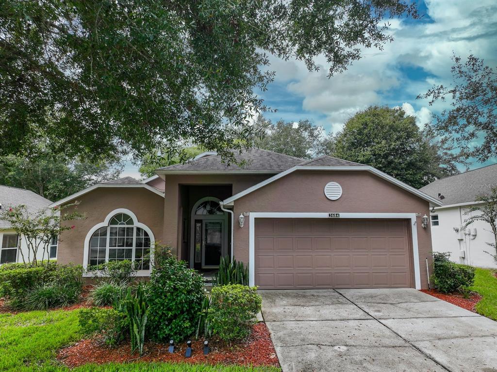 a front view of a house with garage