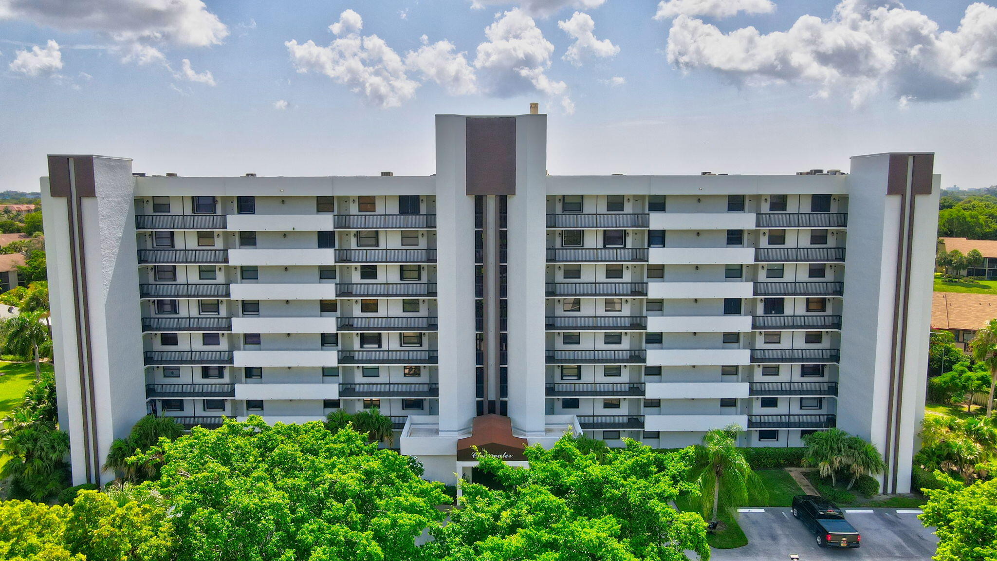 front view of a building with a garden