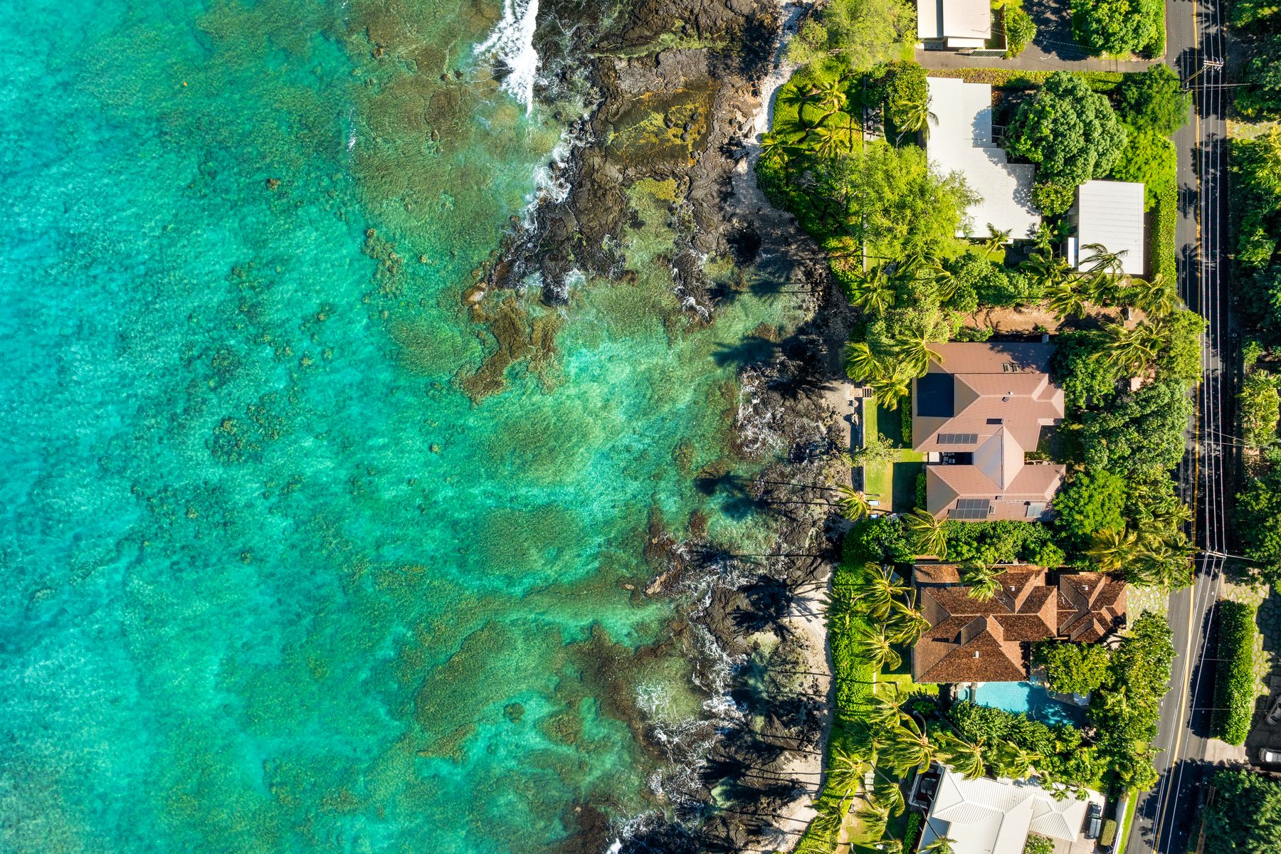 Private stairs from yard lead to easy water access to some of the best marine life in Puako.