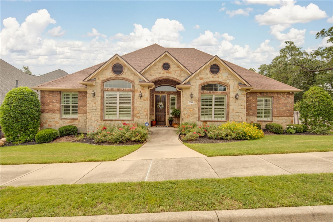 a front view of a house with yard