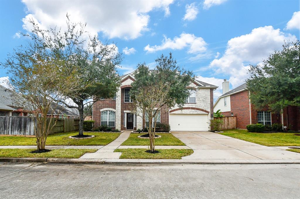 Welcome to 5518 Granite Meadow! Stunning front elevation with a welcoming façade, beautifully landscaped yard, and charming curb appeal. This home blends elegance with functionality, offering the perfect first impression