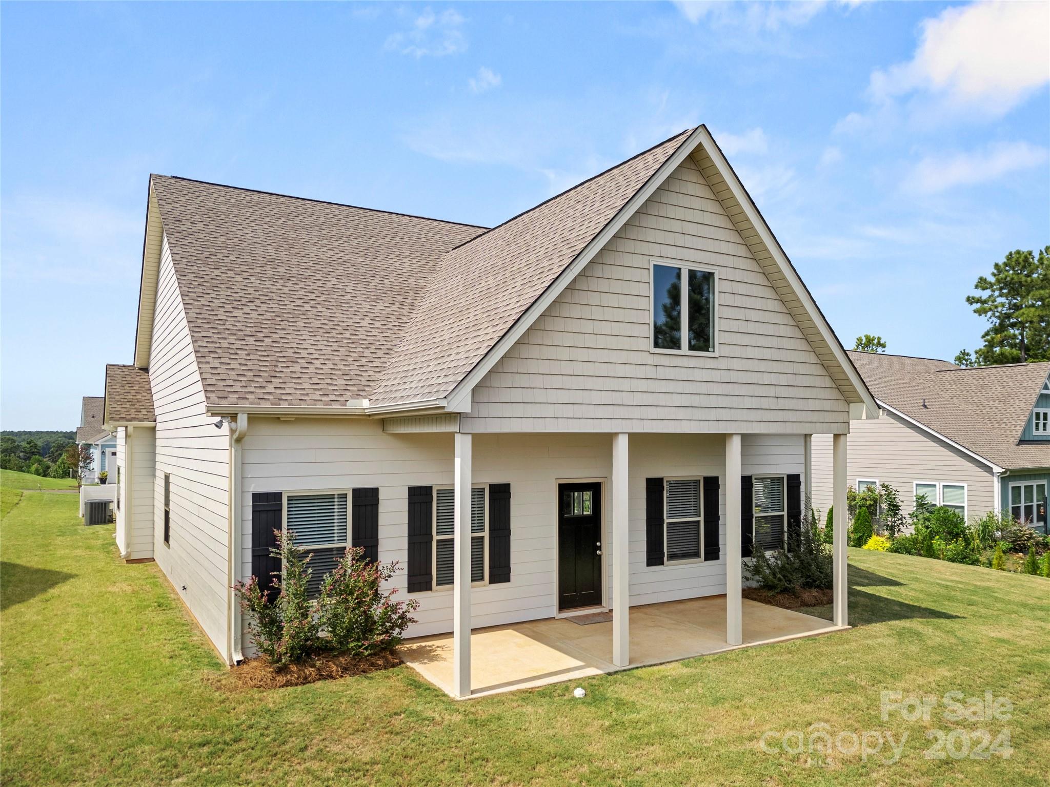 a view of a house with backyard porch and garden