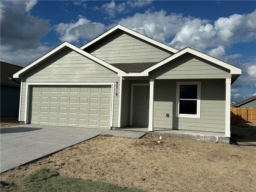 a front view of a house with garage