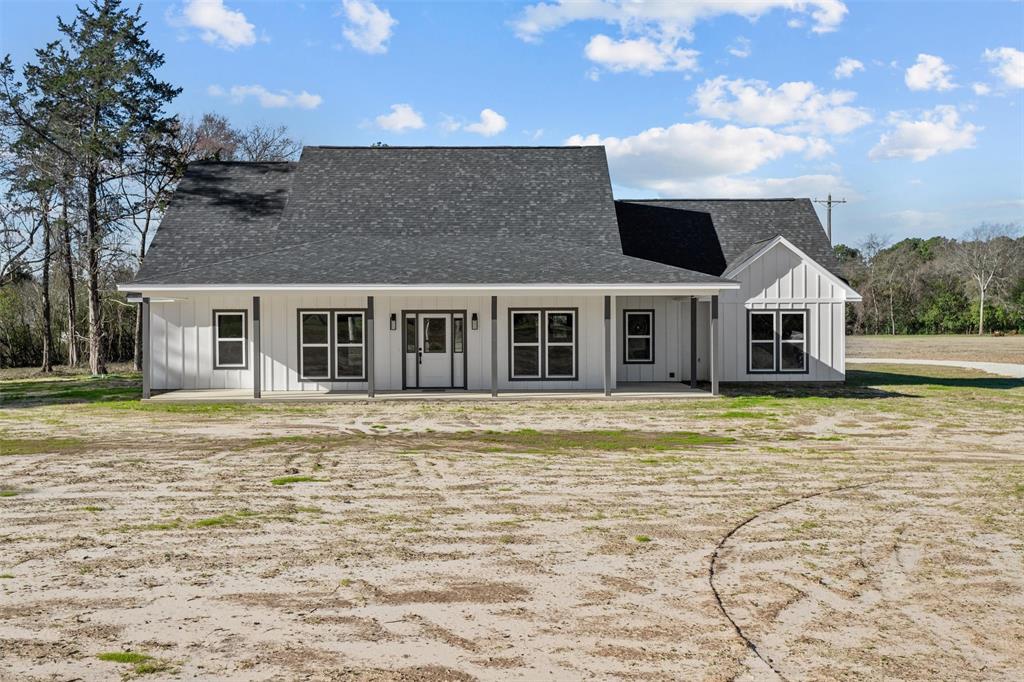 a front view of a house with a swimming pool