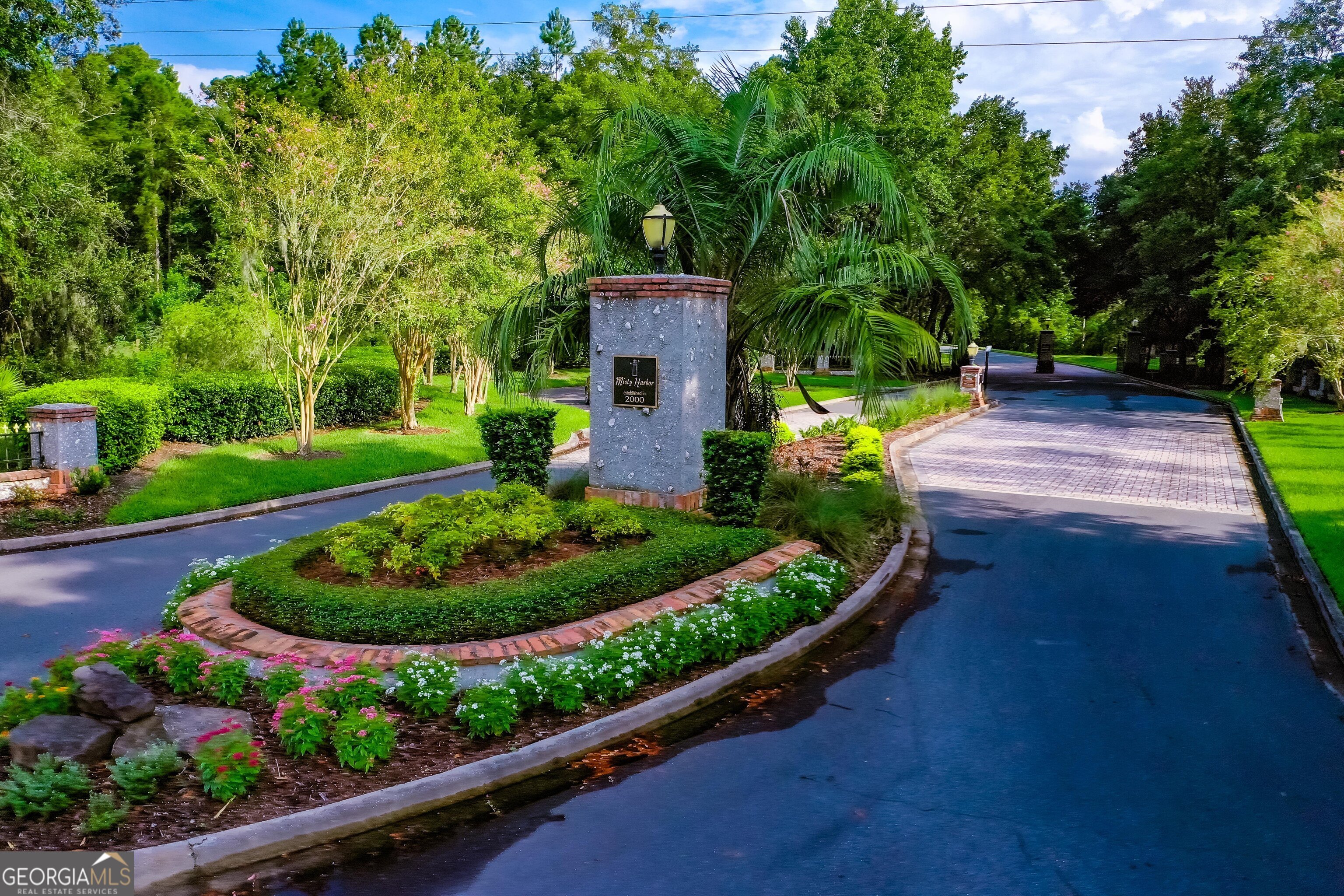 a view of a garden with a fountain