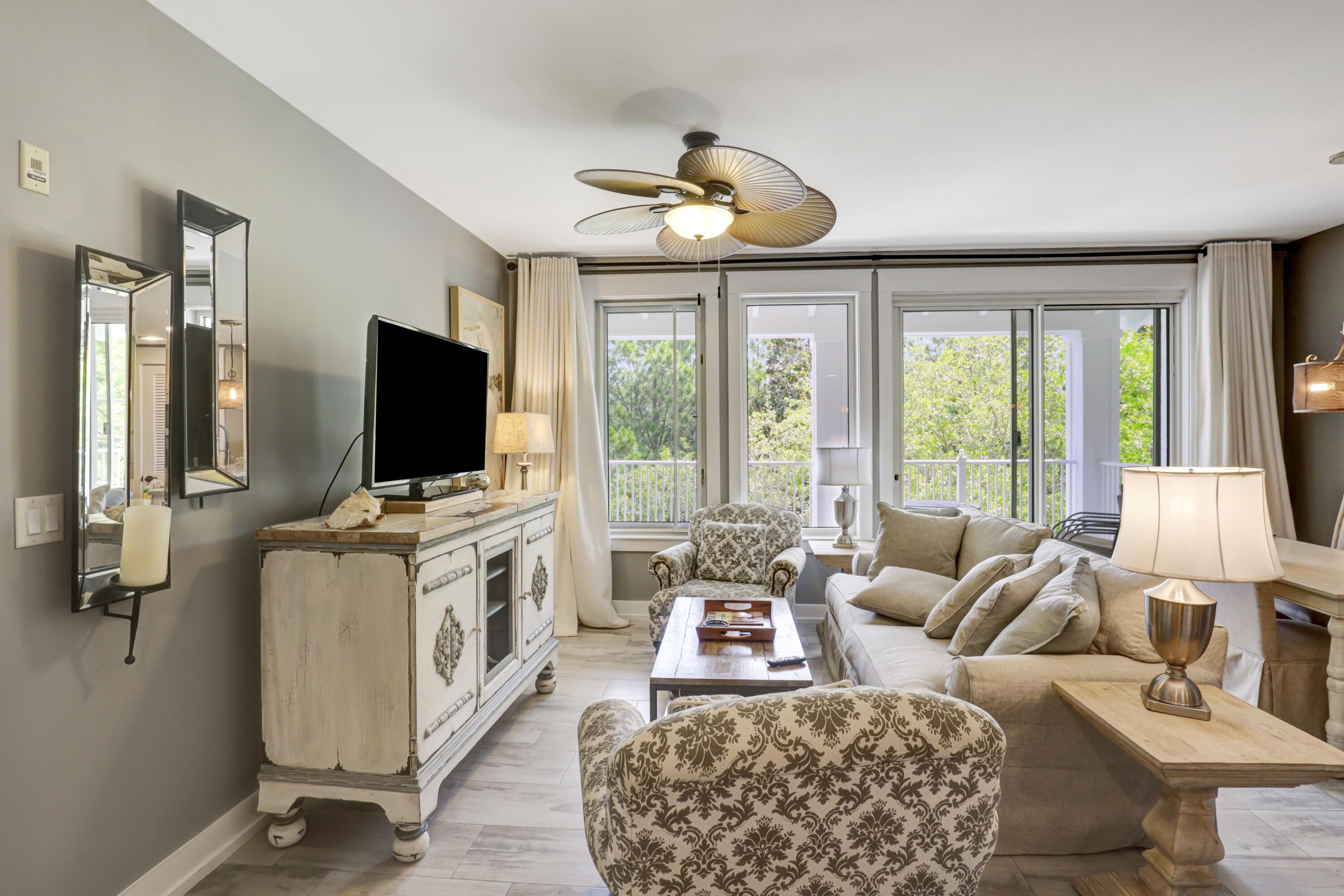 a living room with furniture and a flat screen tv