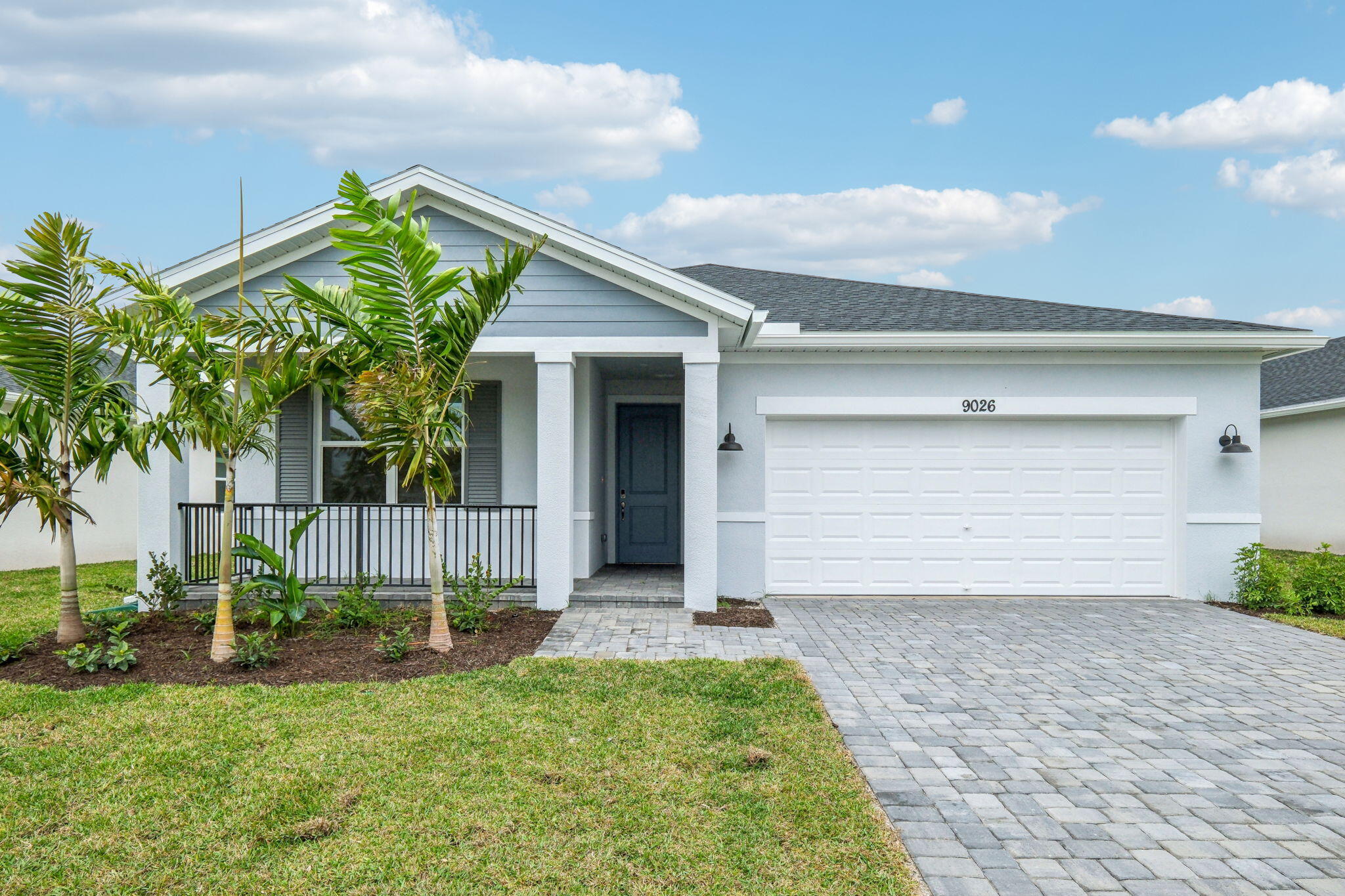 a front view of house with yard and green space