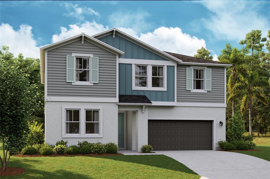 a front view of a house with a yard and garage