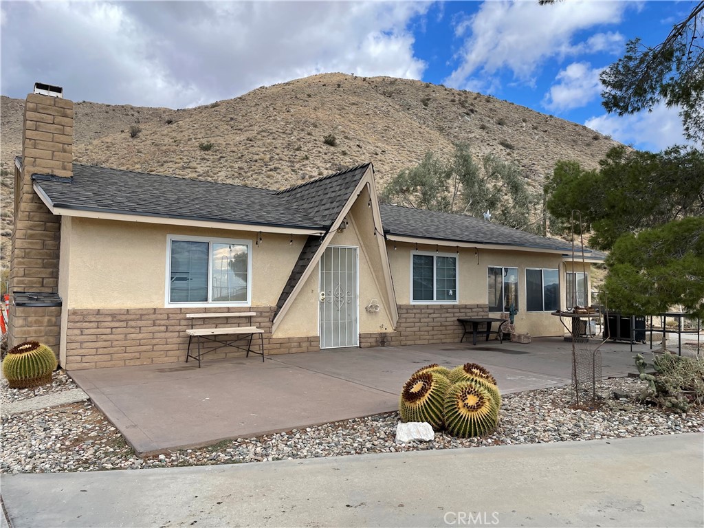 a front view of a house with parking space