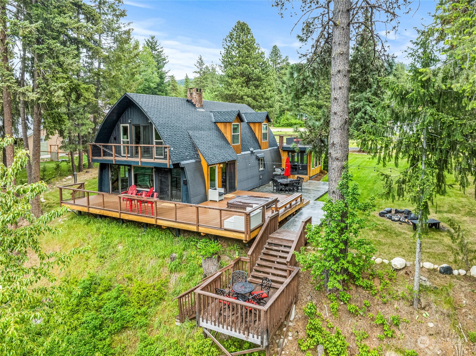 a view of an house with roof deck and a yard