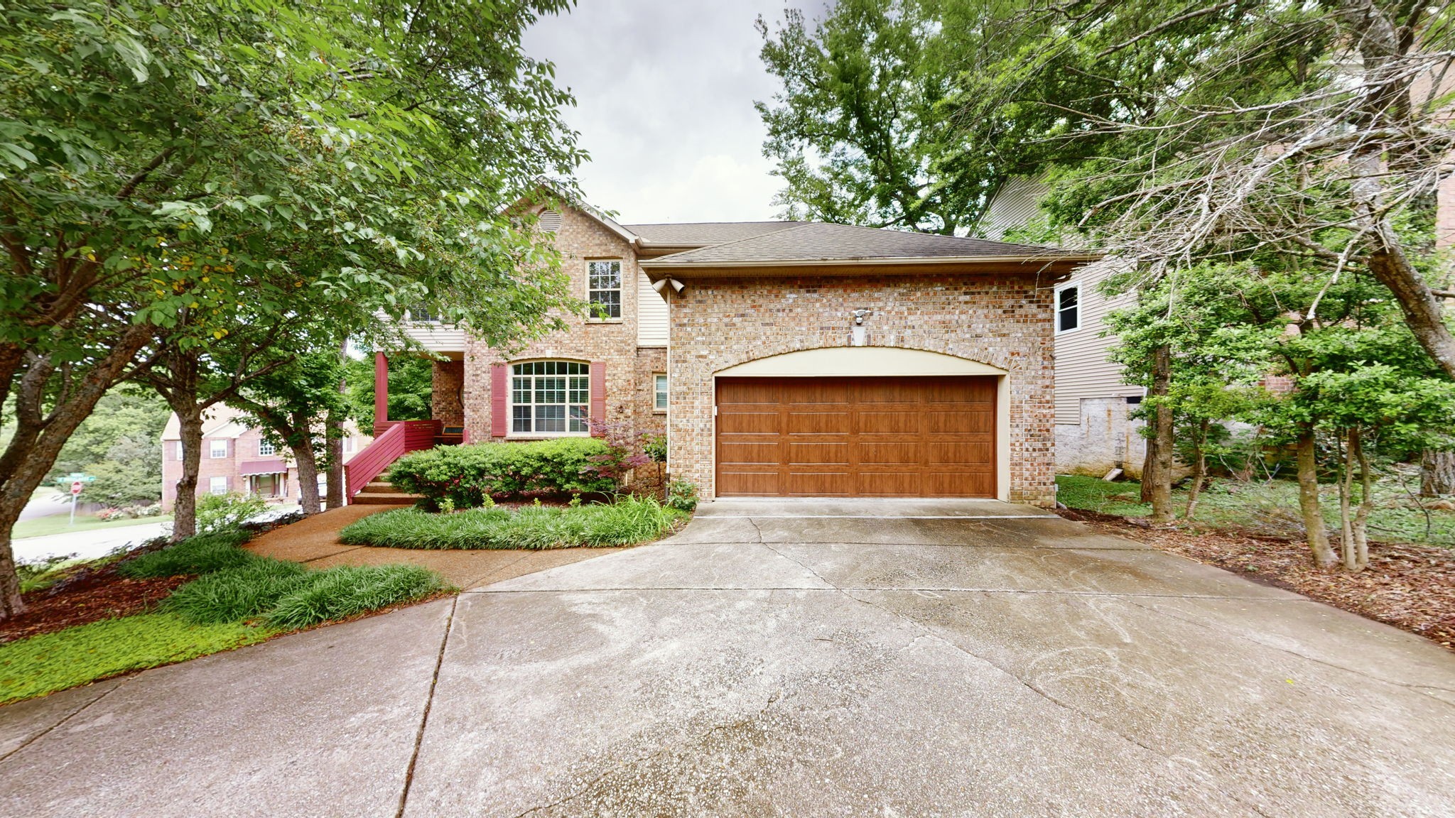 front view of a house with a garden