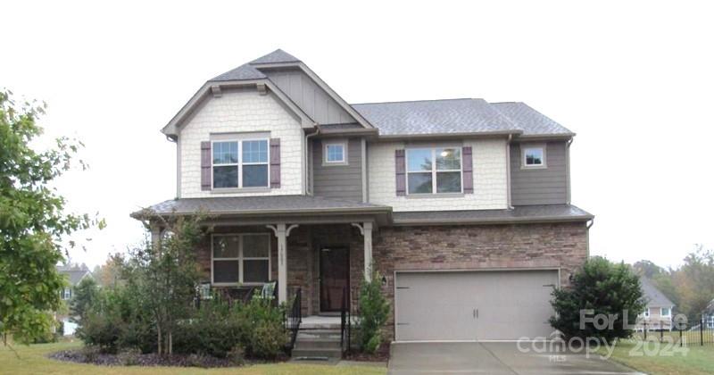 a front view of a house with a garage