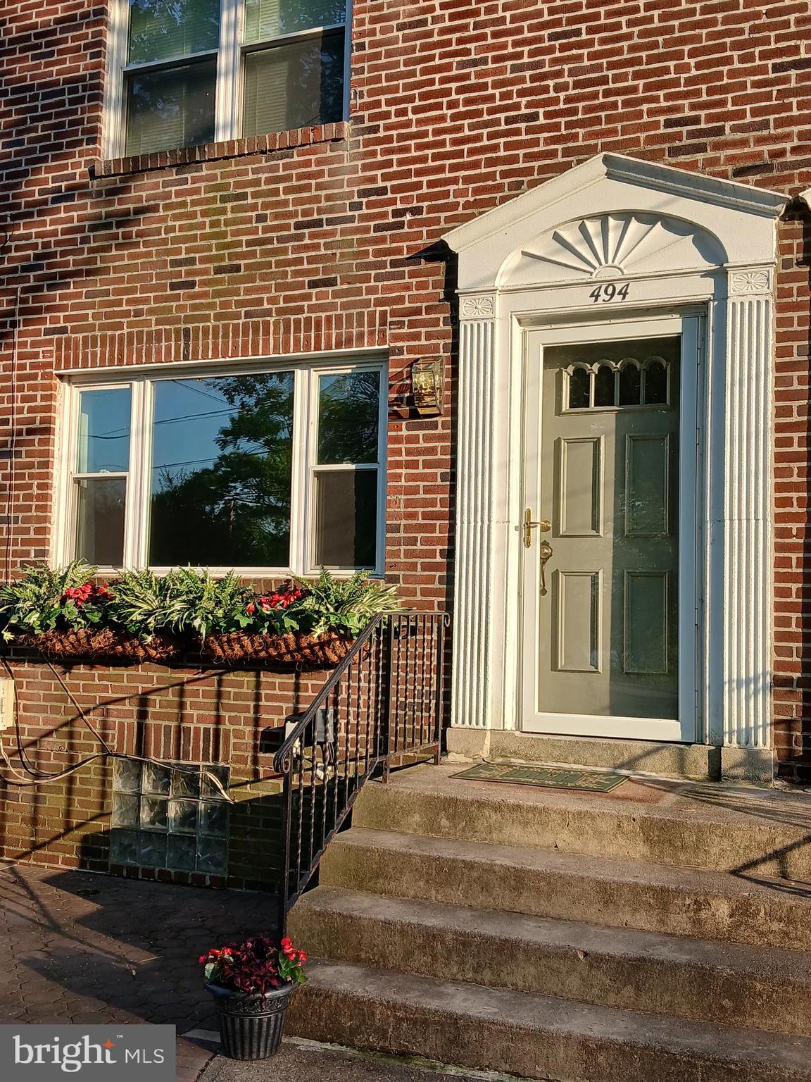 a front view of a house with a porch