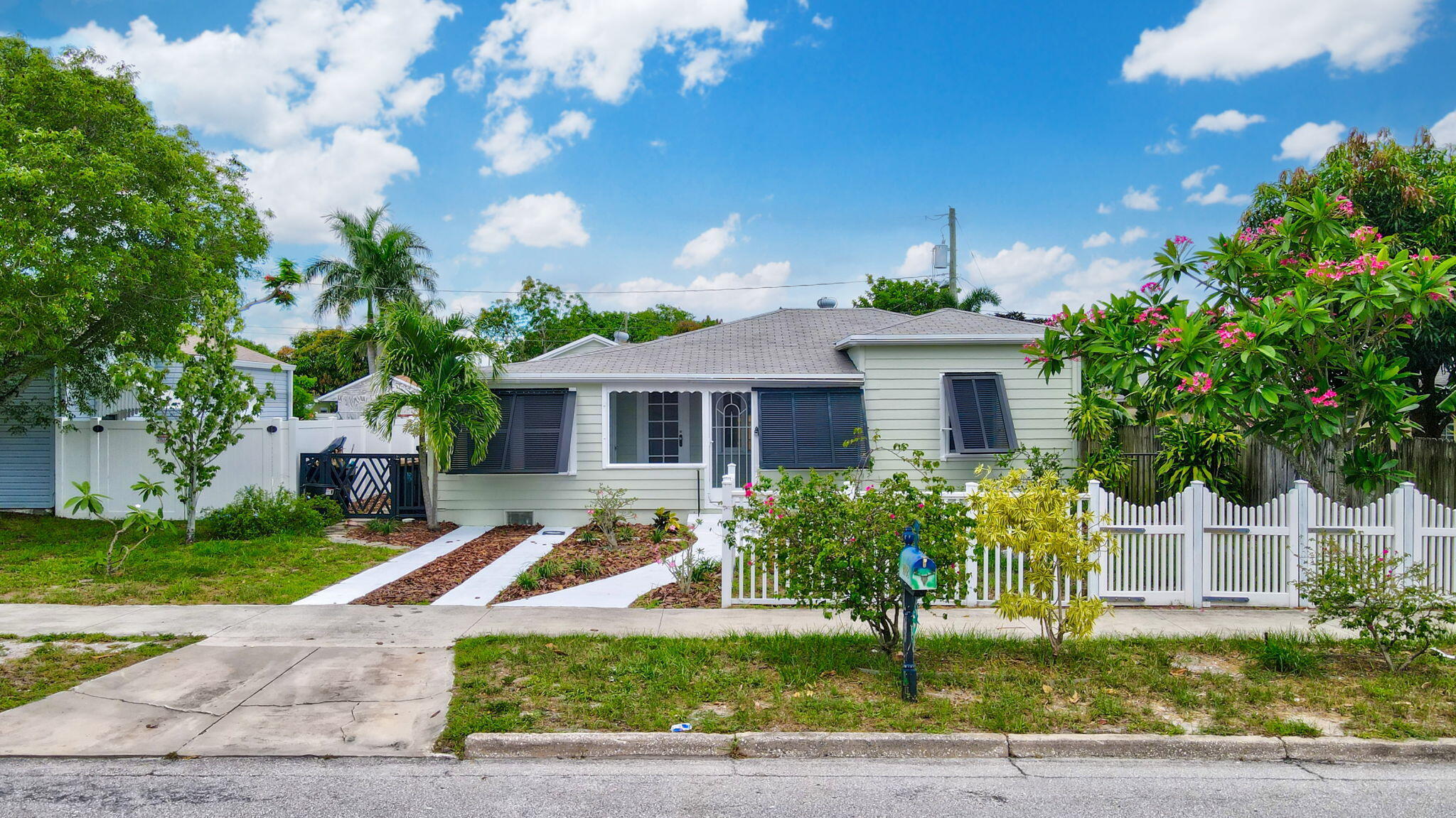 a front view of a house with garden