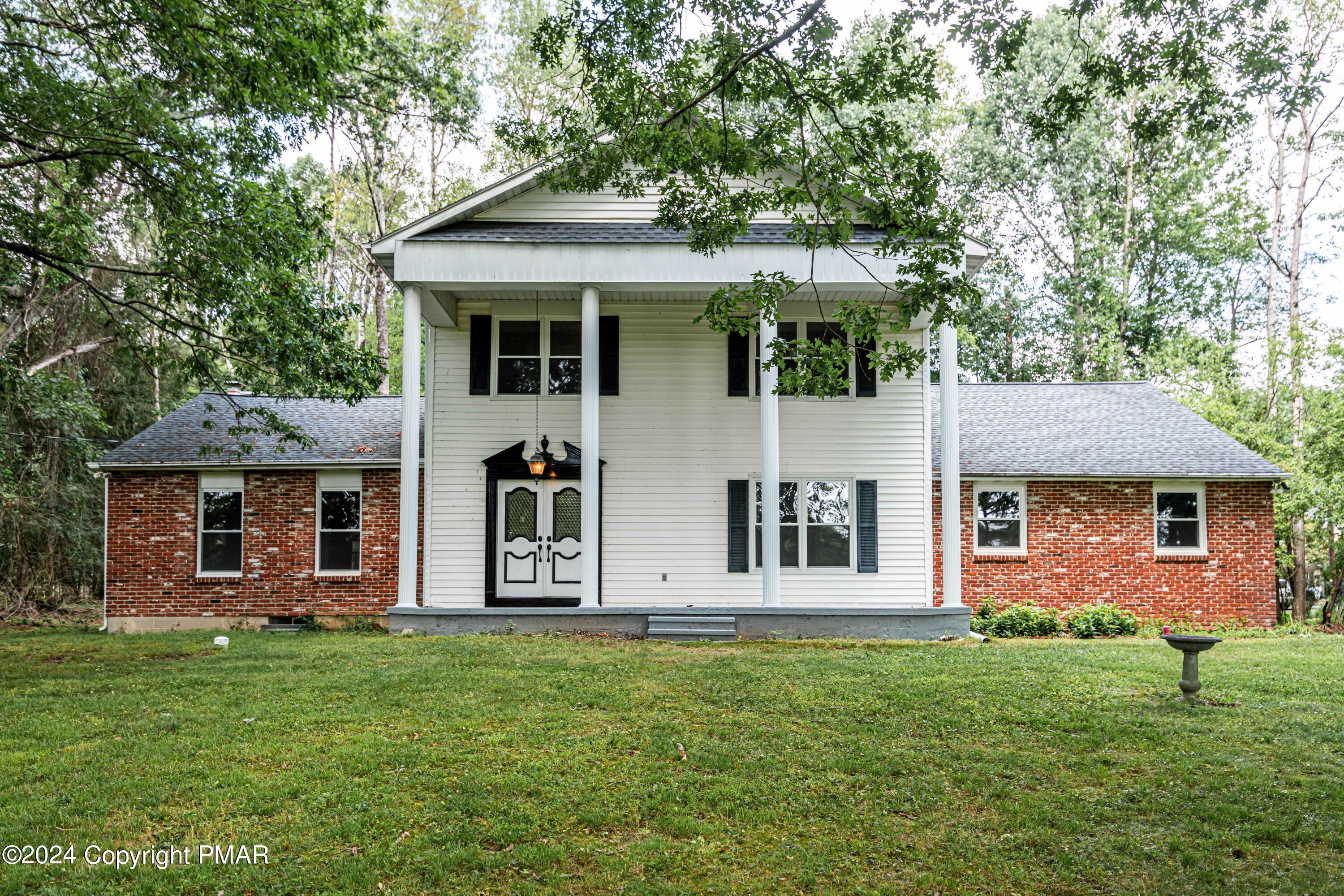 front view of a house with a yard