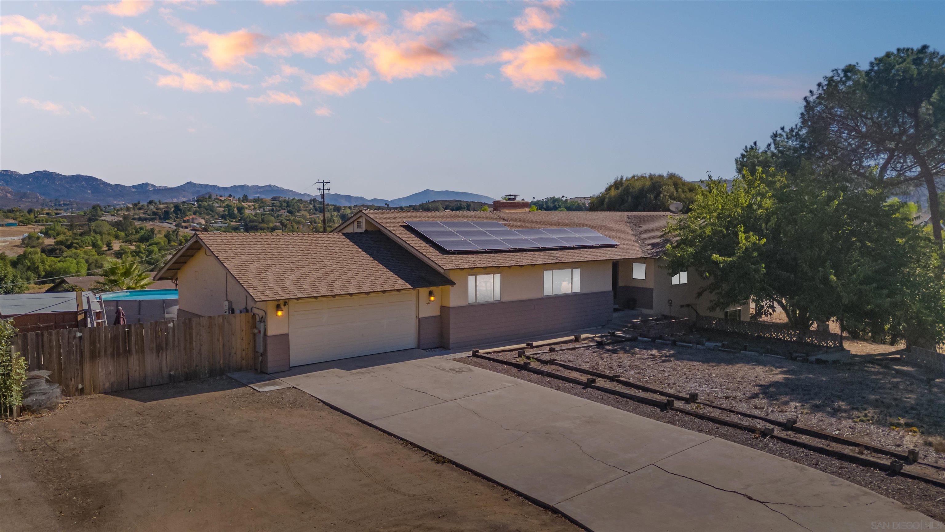 a aerial view of a house with a yard