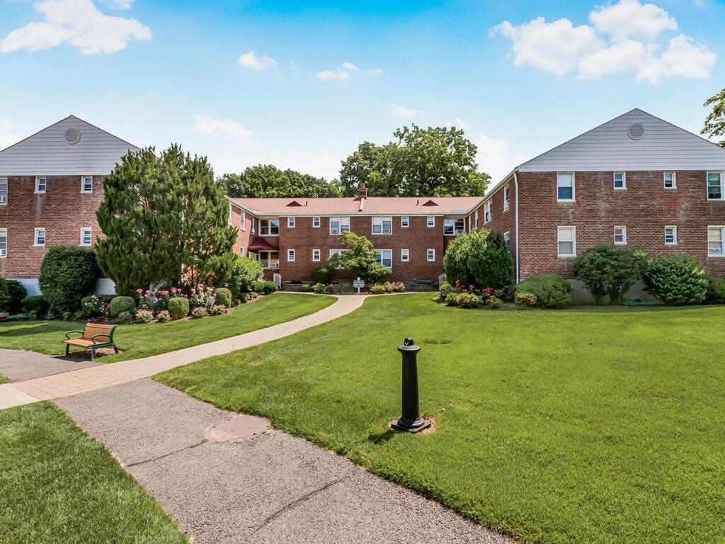 View of property's community featuring a yard