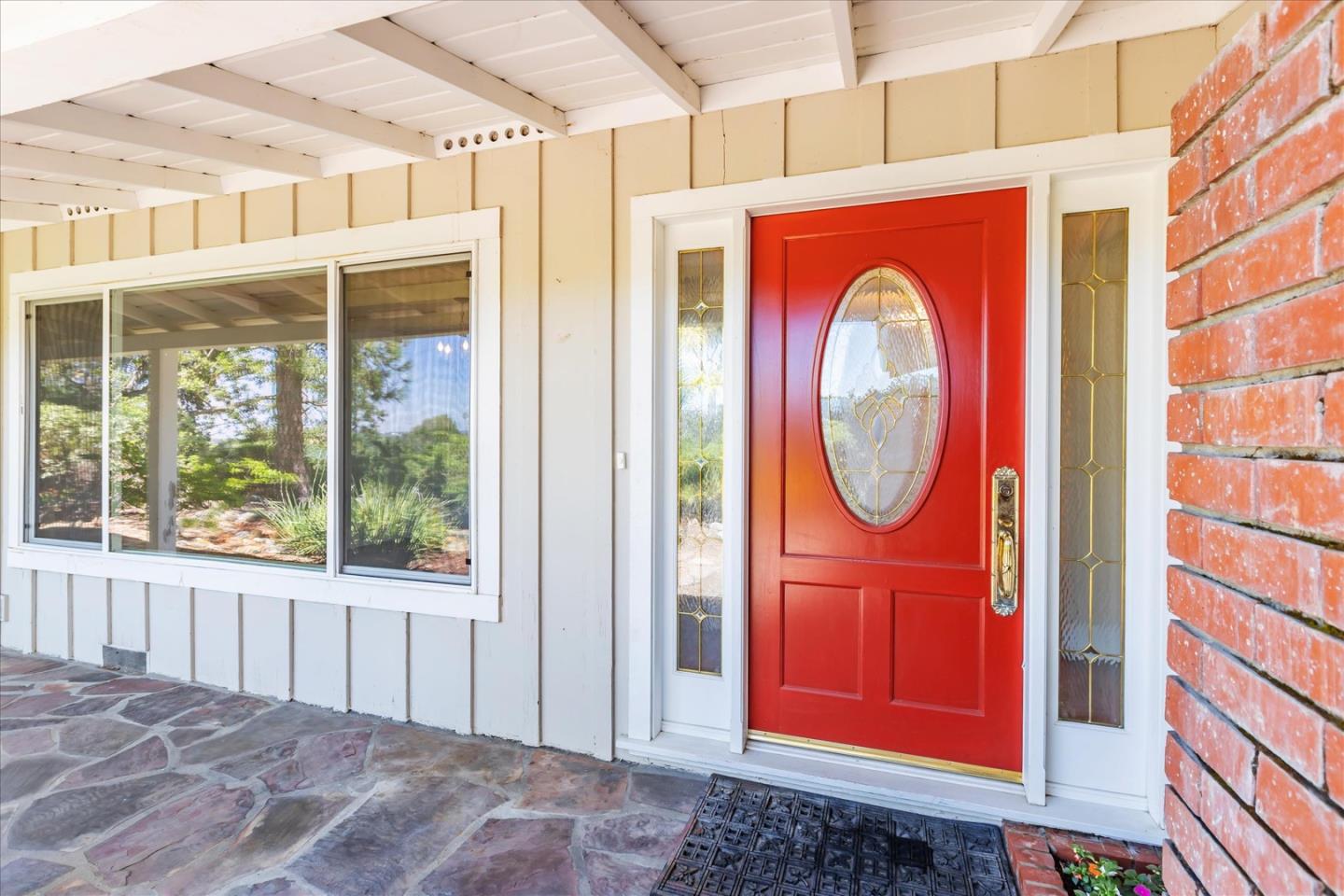 a view of front door with outdoor seating