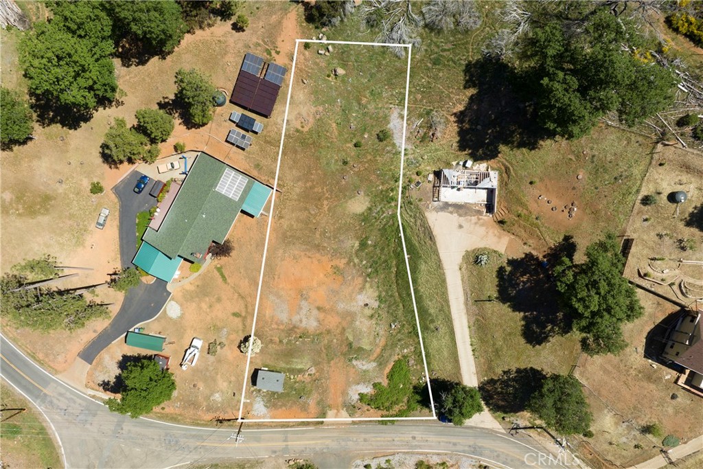 an aerial view of residential house with outdoor space