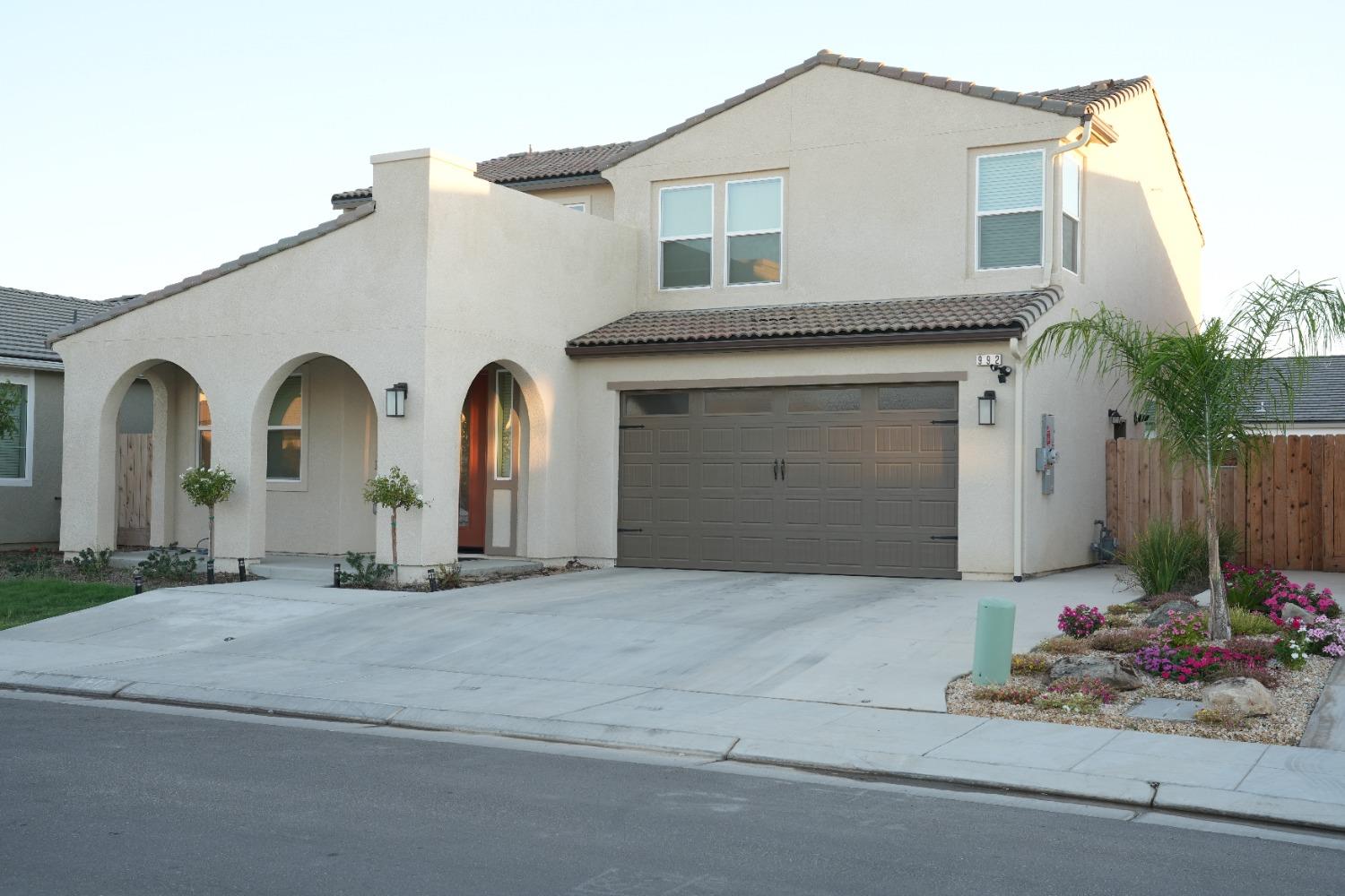 a front view of a house with a garage