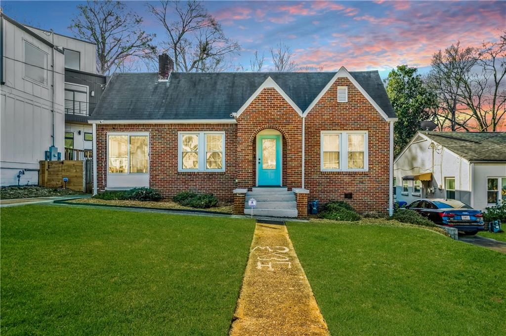 a front view of a house with a yard