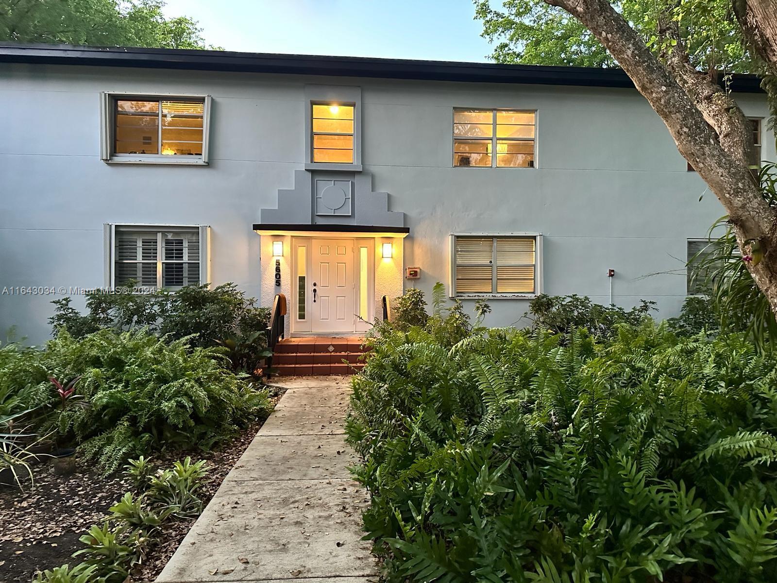 a house that has a lot of plants in it