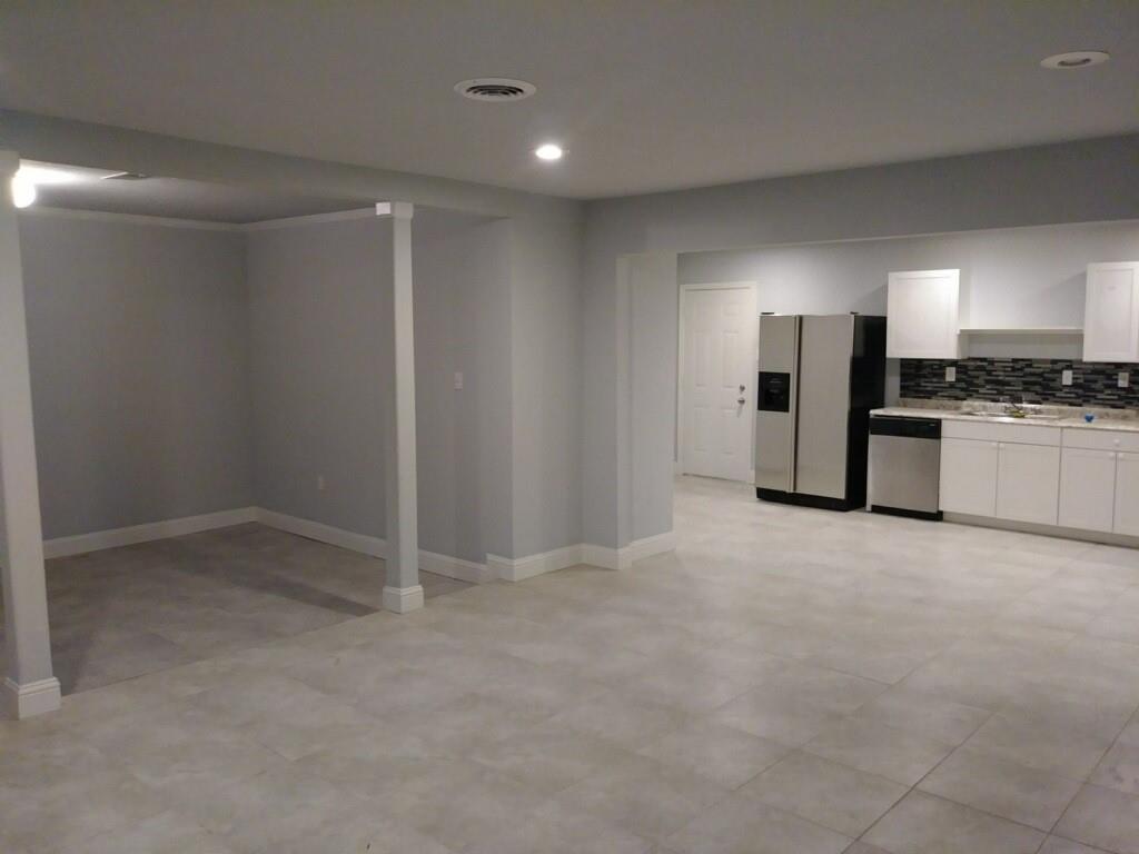 a view of a kitchen with a sink