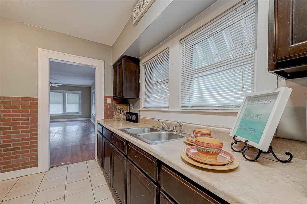 a kitchen with sink and cabinets