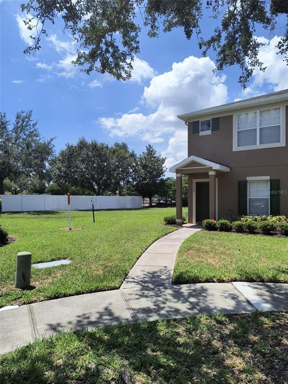 a front view of a house with a yard