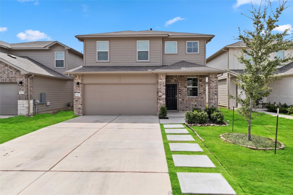 a front view of house with yard