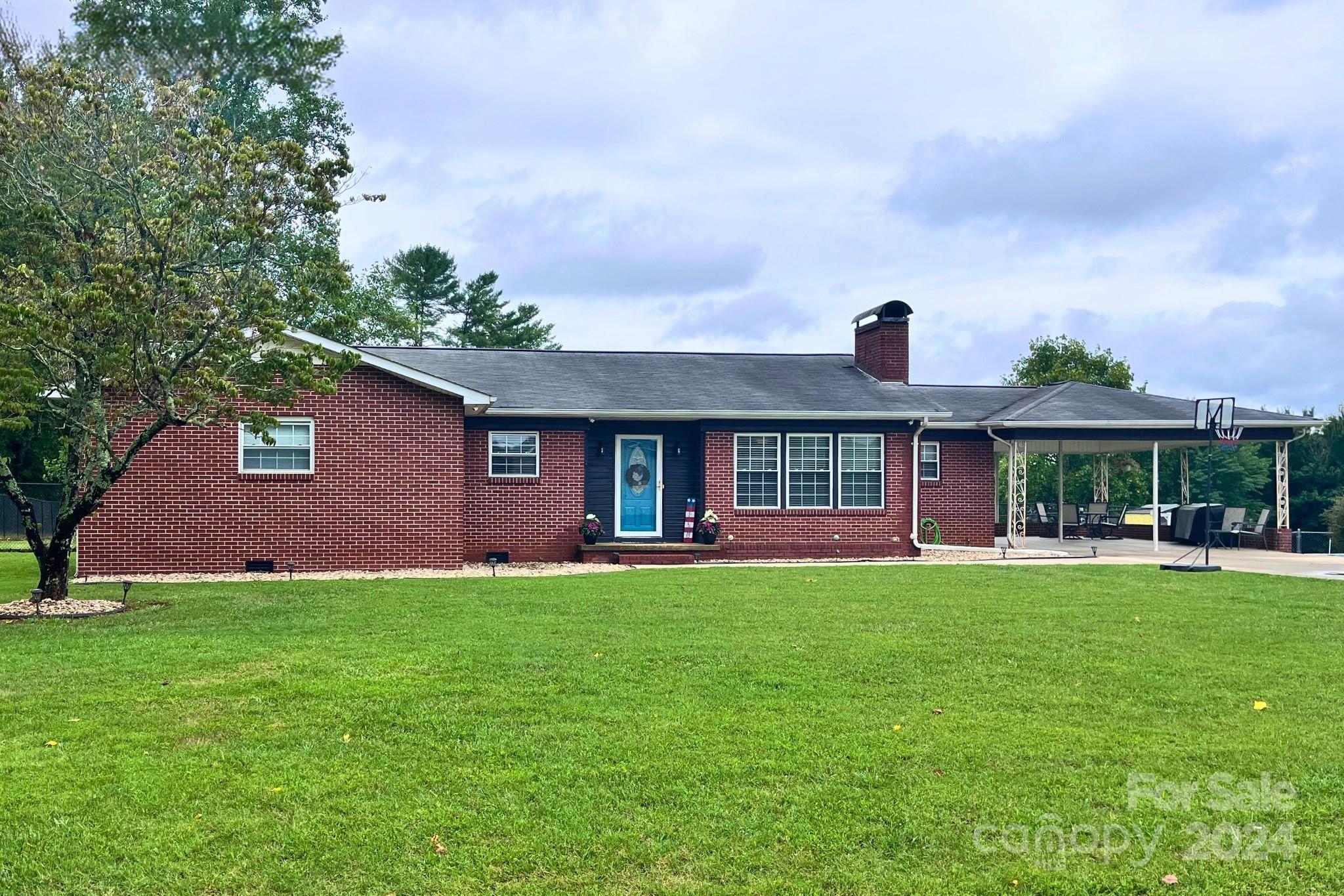 a front view of a house with a yard