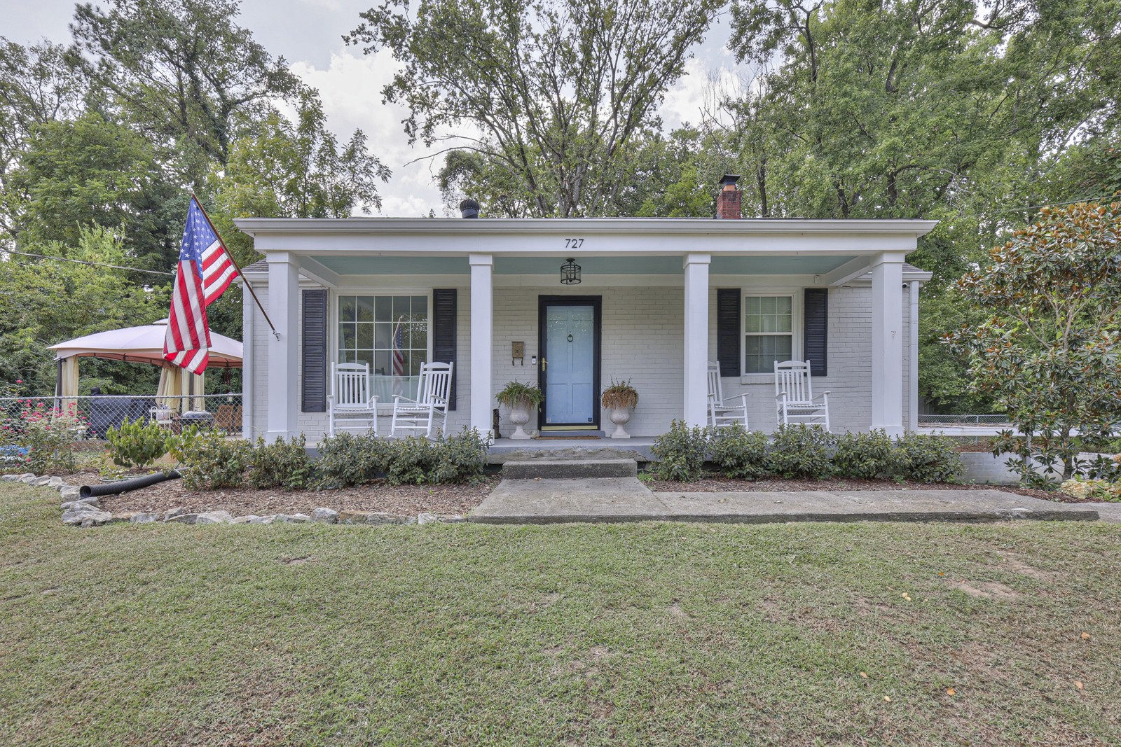 front view of a house with a yard