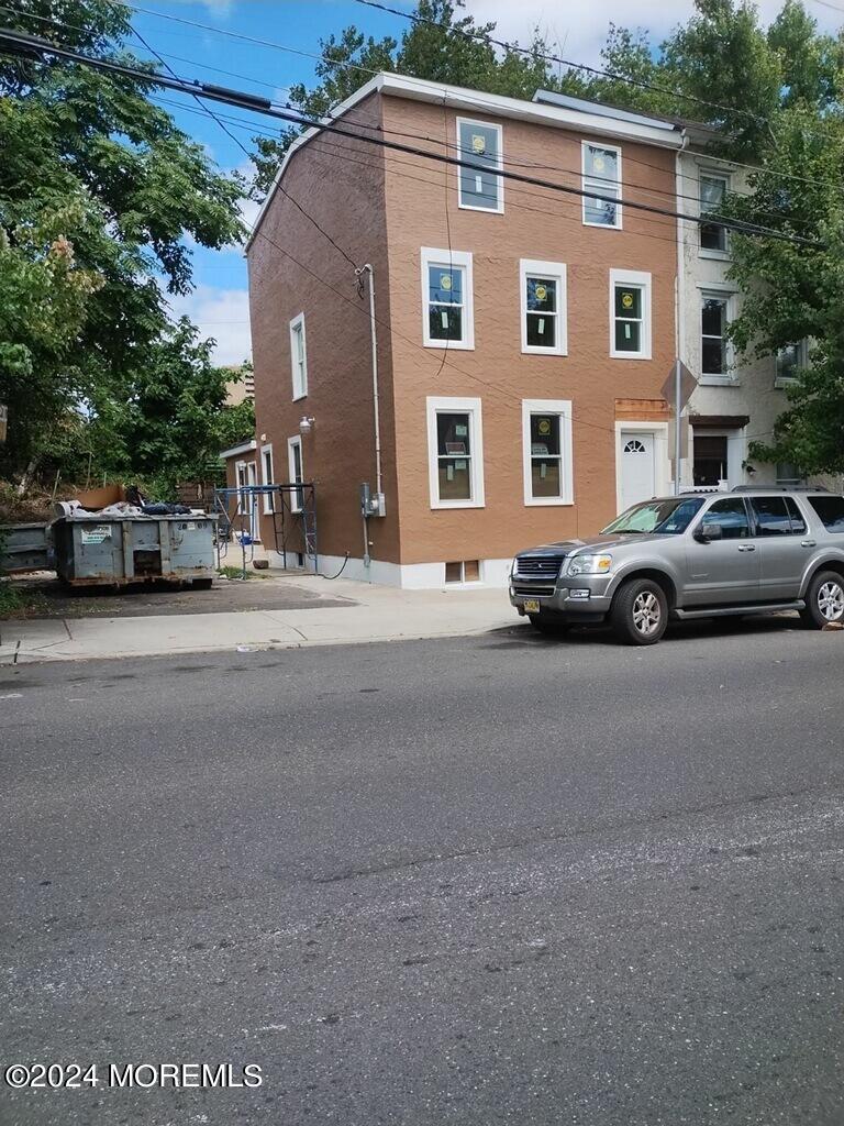 a view of a car parked in front of a house