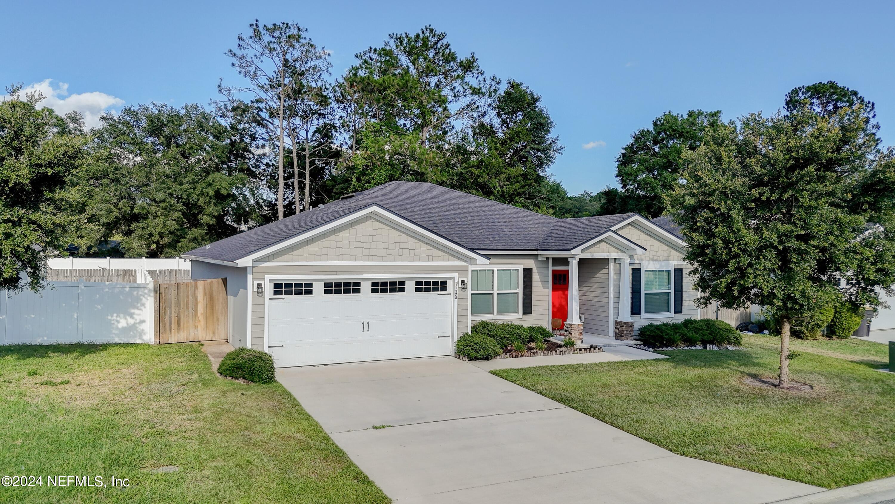 a front view of a house with yard