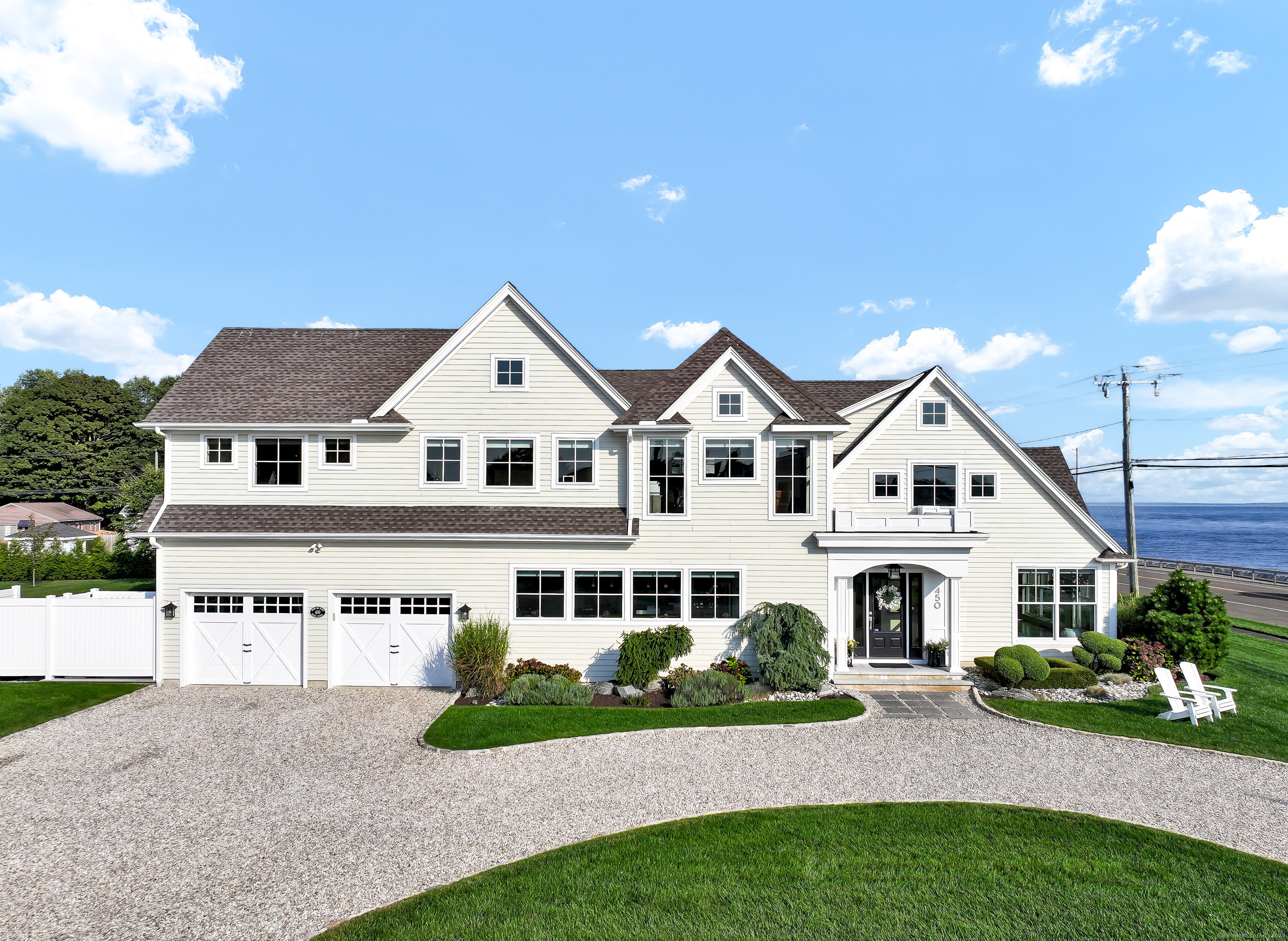 a view of house with garden and garage