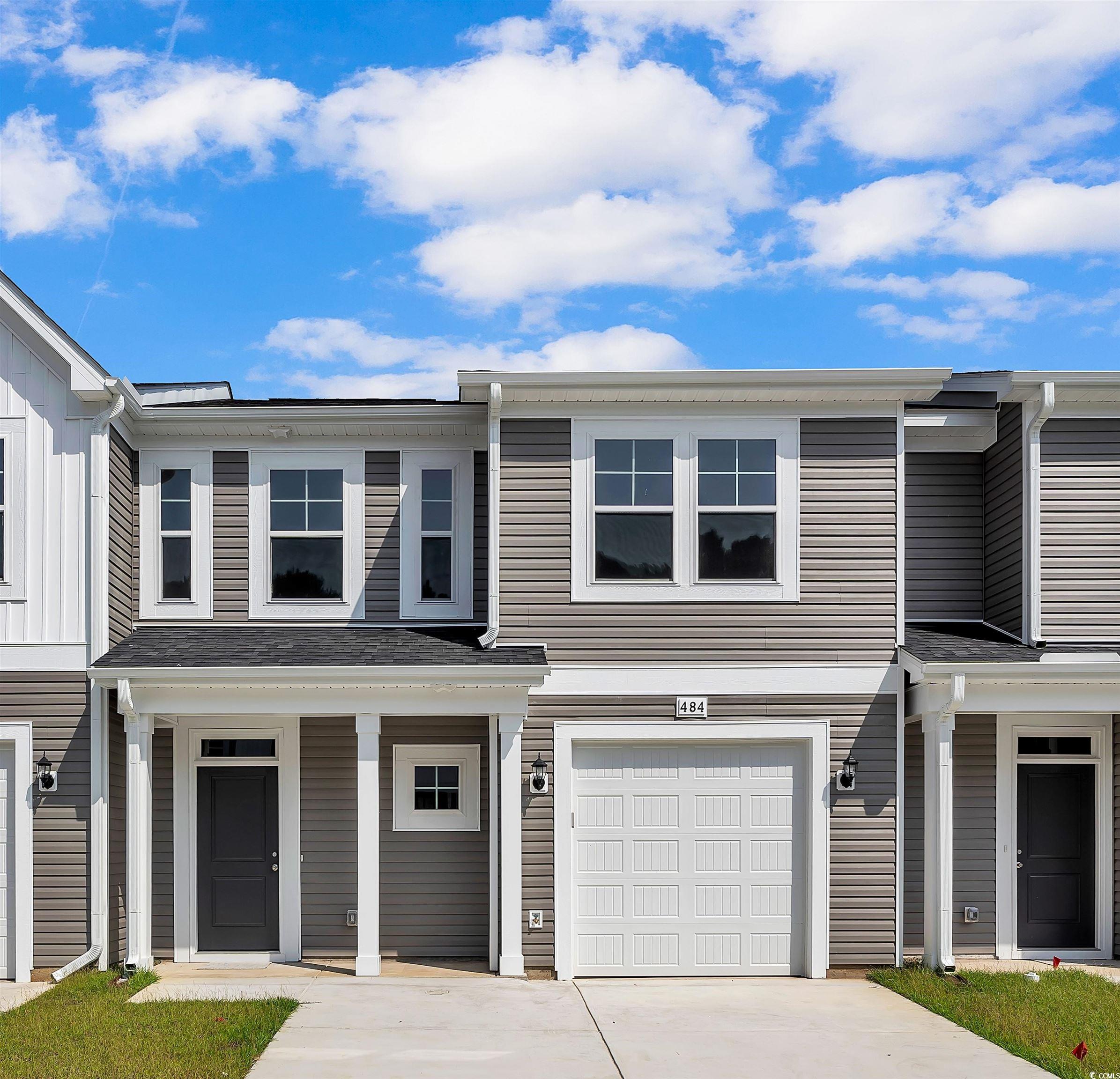 Multi unit property featuring a garage