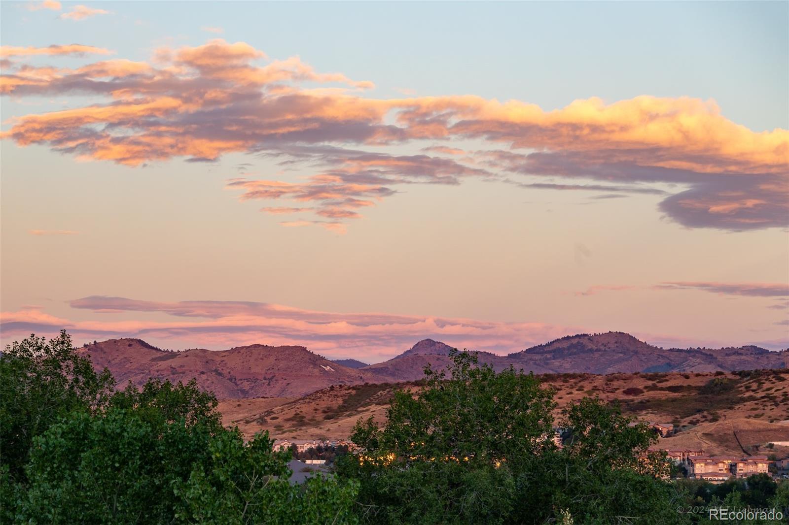 an aerial view of mountain with an outdoor space