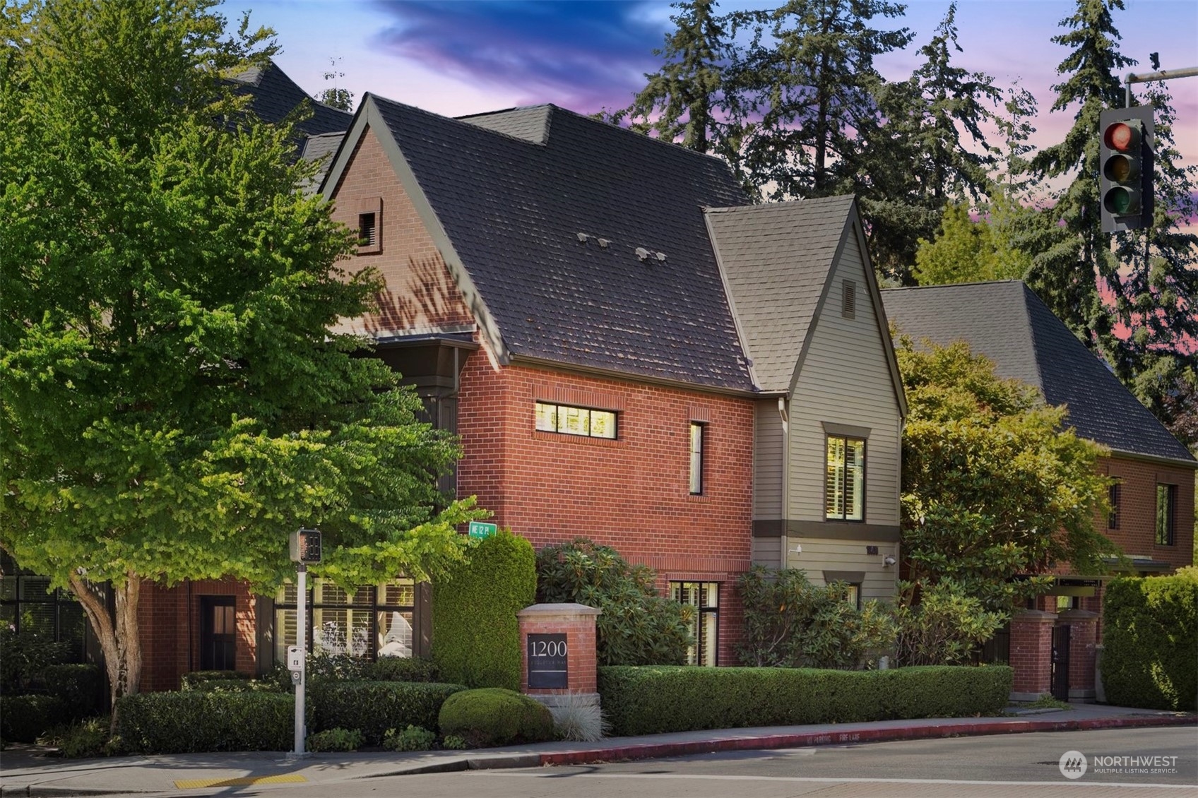 a front view of a house with trees