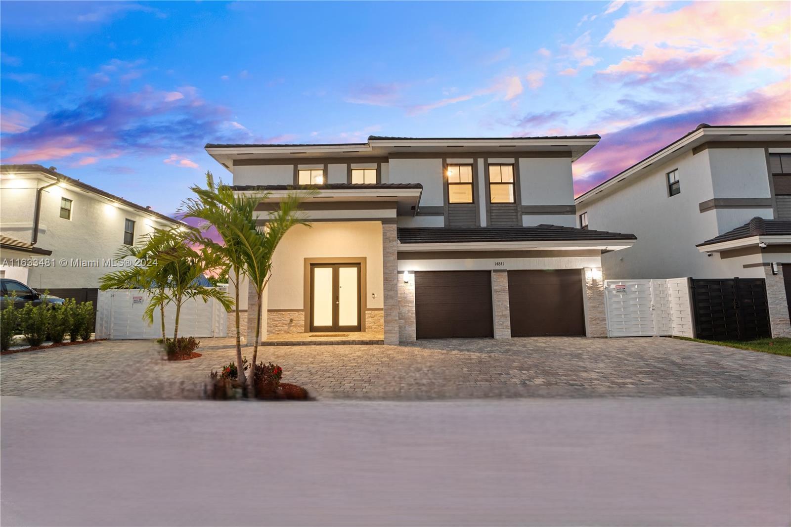 a front view of a house with yard