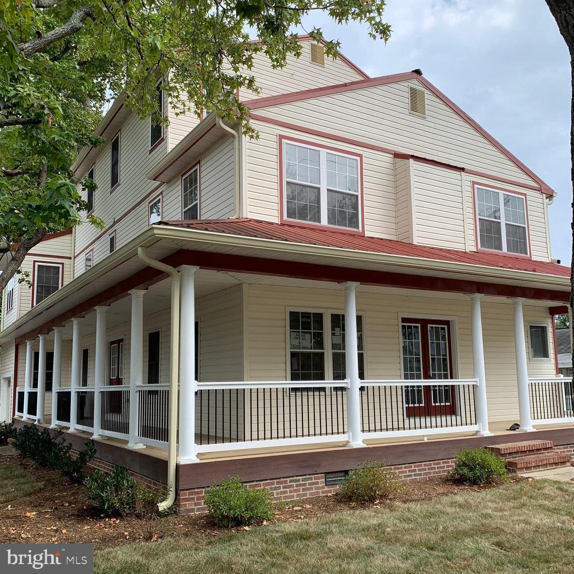 a front view of a house with a porch