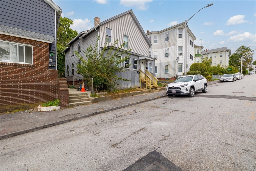 a car parked in front of a house