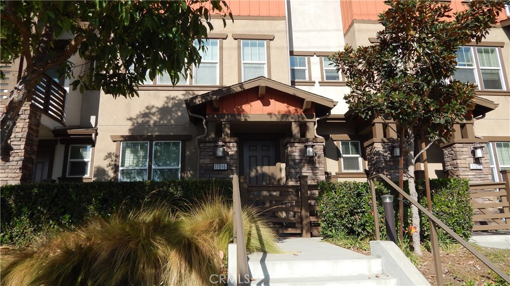 a view of a house with a tree