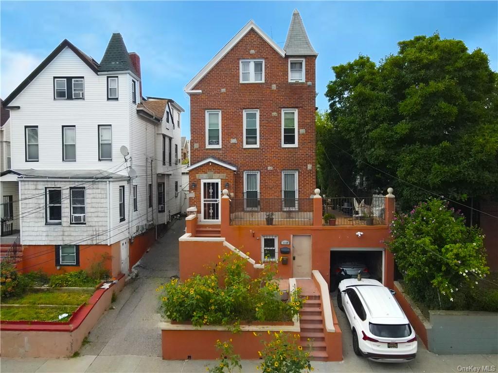 Victorian home featuring a garage